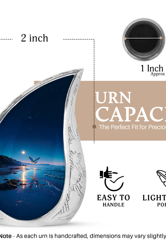 Calming Blue Butterfly Cremation Urn angled view of lid and engraved motif - smooth teardrop contour featuring butterfly art - mini keepsake memorial for portion of cremation ashes