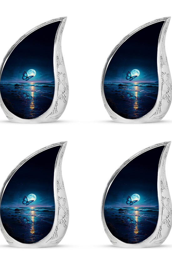 Cobalt Blue Butterfly Cremation Urn close-up of engraving and surface detail - graceful tear-shaped urn with butterfly motif - 10 inch aluminum urn for cremated remains