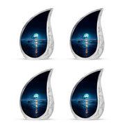 Cobalt Blue Butterfly Cremation Urn close-up of engraving and surface detail - graceful tear-shaped urn with butterfly motif - 10 inch aluminum urn for cremated remains
