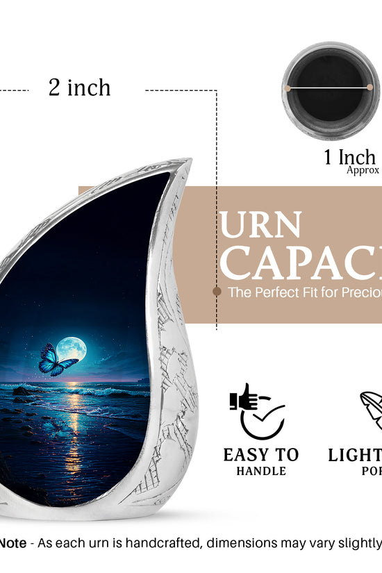 Navy Blue Butterfly Cremation Urn angled view of lid and engraved motif - flowing teardrop butterfly silhouette on curved aluminum - mini keepsake memorial for portion of cremation ashes