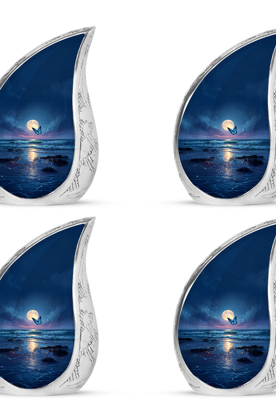 Vivid Blue Butterfly Cremation Urn close-up of engraving and surface detail - graceful tear-shaped urn with butterfly motif - 10 inch aluminum urn for cremated remains