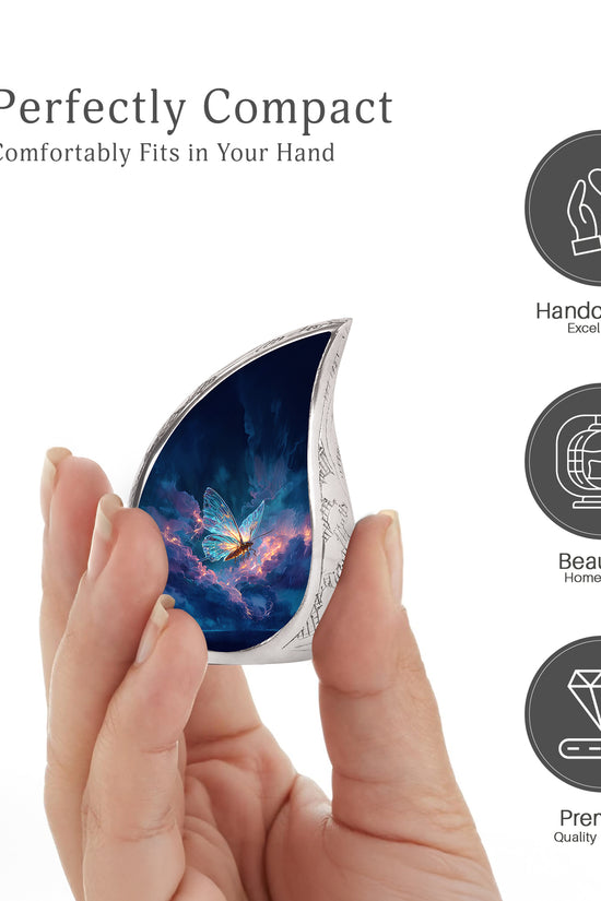 Cobalt Blue Butterfly Cremation Urn angled view of lid and engraved motif - graceful tear-shaped urn with butterfly motif - mini keepsake memorial for portion of cremation ashes