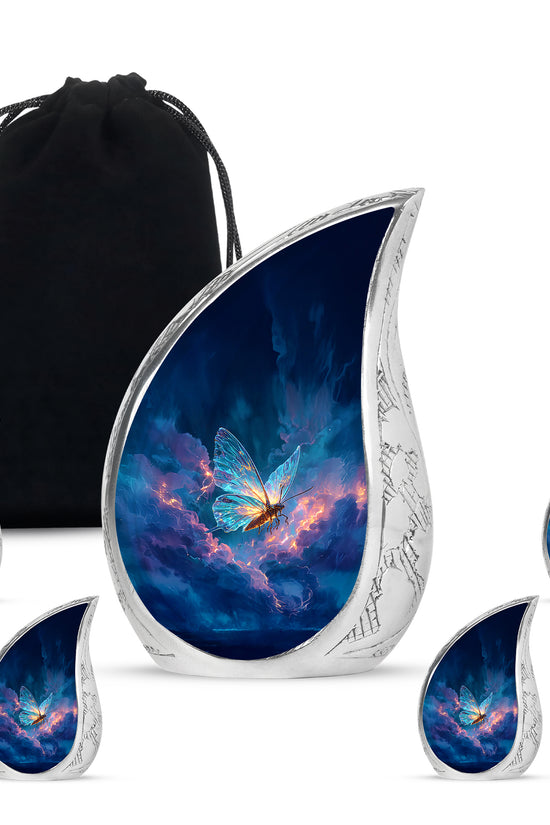 Misty Blue Butterfly Cremation Urn side profile showing urn shape - rounded teardrop butterfly design with delicate detail - memorial set with one large and four small urns