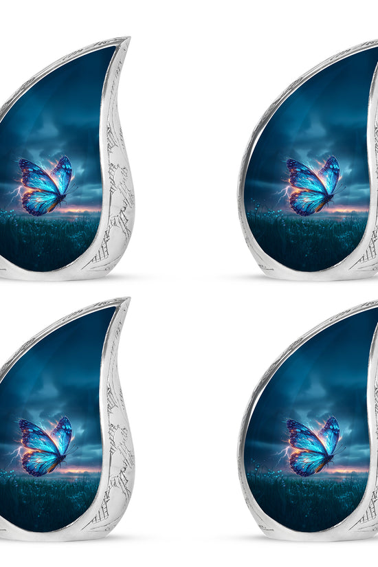 Vivid Blue Butterfly Cremation Urn close-up of engraving and surface detail - smooth teardrop contour featuring butterfly art - 10 inch aluminum urn for cremated remains