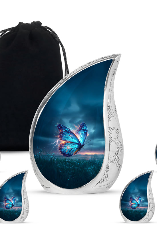 Cornflower Blue Butterfly Cremation Urn side profile showing urn shape - graceful tear-shaped urn with butterfly motif - memorial set with one large and four small urns