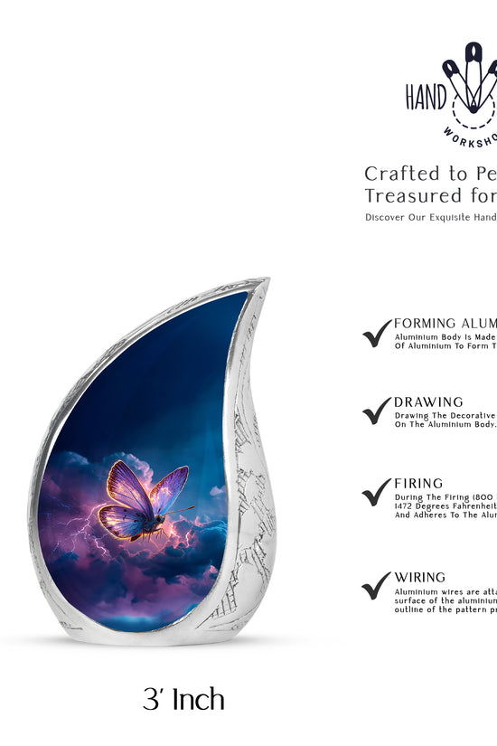 Pastel Blue Butterfly Cremation Urn angled view of lid and engraved motif - flowing teardrop butterfly silhouette on curved aluminum - mini keepsake memorial for portion of cremation ashes