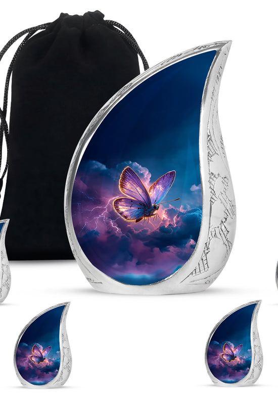 Cobalt Blue Butterfly Cremation Urn side profile showing urn shape - graceful tear-shaped urn with butterfly motif - memorial set with one large and four small urns