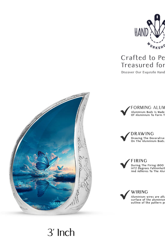 Azure Butterfly Cremation Urn angled view of lid and engraved motif - rounded teardrop butterfly design with delicate detail - mini keepsake memorial for portion of cremation ashes