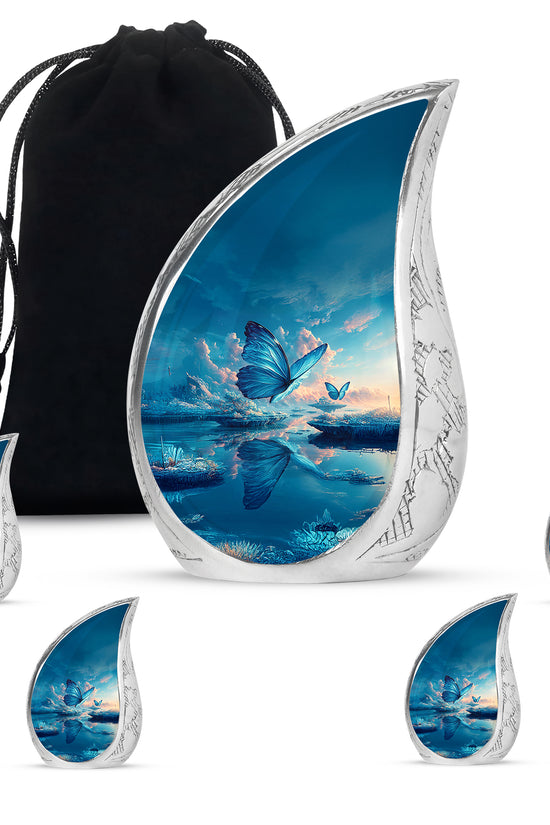 Twilight Blue Butterfly Cremation Urn side profile showing urn shape - graceful tear-shaped urn with butterfly motif - memorial set with one large and four small urns