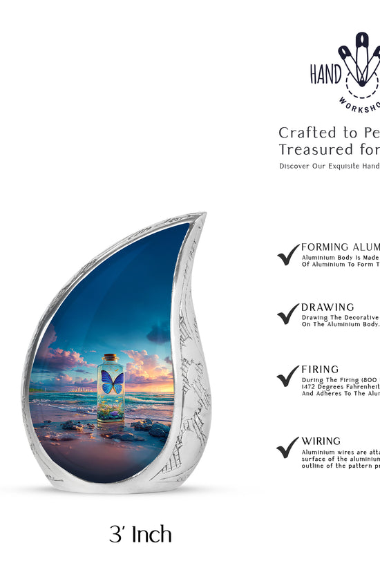 Cornflower Blue Butterfly Cremation Urn angled view of lid and engraved motif - smooth teardrop contour featuring butterfly art - mini keepsake memorial for portion of cremation ashes