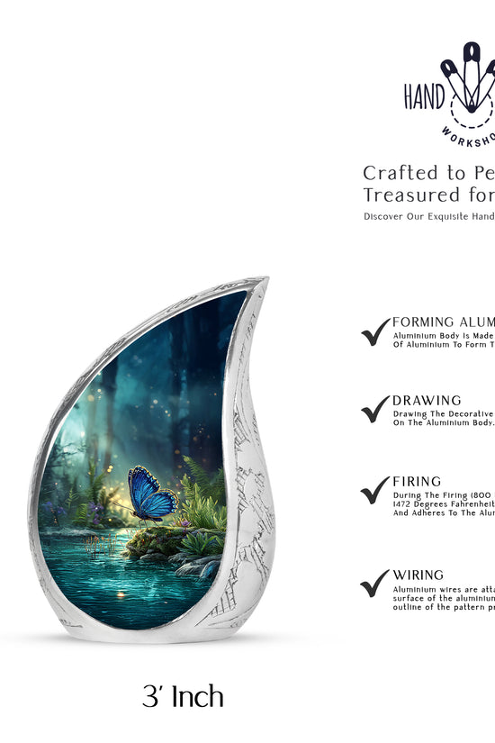 Serene Blue Butterfly Cremation Urn angled view of lid and engraved motif - graceful tear-shaped urn with butterfly motif - mini keepsake memorial for portion of cremation ashes