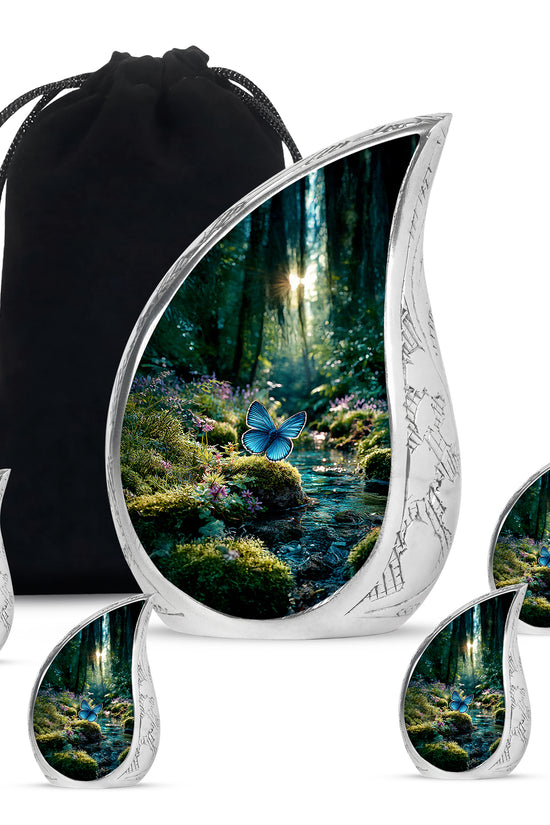 Sage Green Butterfly Cremation Urn side profile showing urn shape - flowing teardrop butterfly silhouette on curved aluminum - memorial set with one large and four small urns