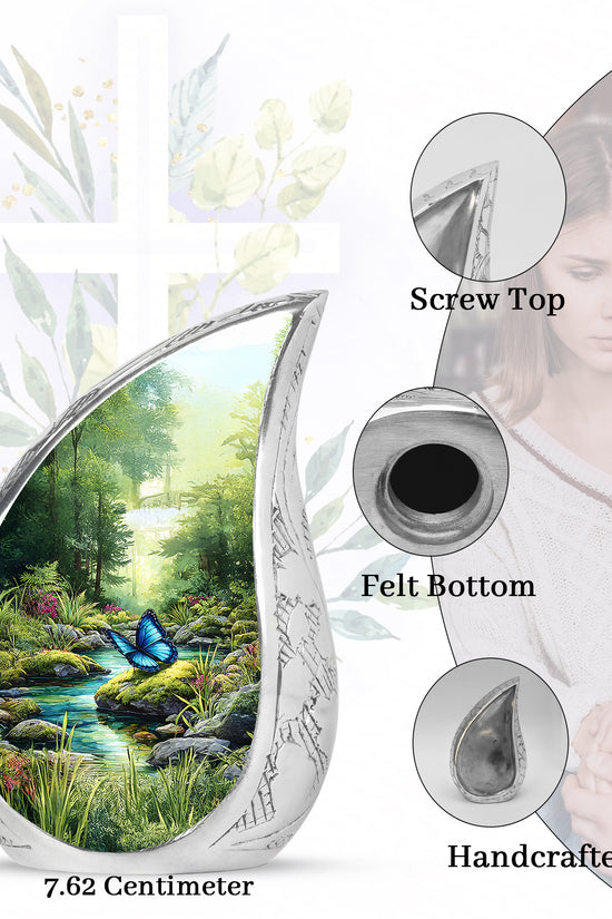 Jade Green Butterfly Cremation Urn angled view of lid and engraved motif - flowing teardrop butterfly silhouette on curved aluminum - mini keepsake memorial for portion of cremation ashes