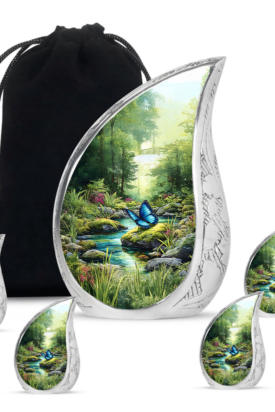Moss Green Butterfly Cremation Urn side profile showing urn shape - flowing teardrop butterfly silhouette on curved aluminum - memorial set with one large and four small urns