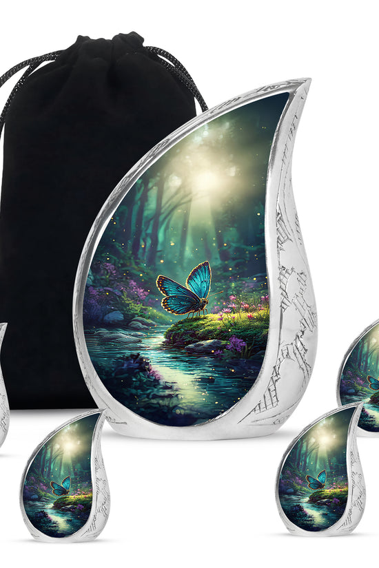 Ocean Teal Butterfly Cremation Urn side profile showing urn shape - rounded teardrop butterfly design with delicate detail - memorial set with one large and four small urns