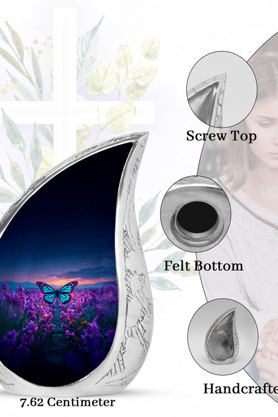 Sapphire Blue Butterfly Cremation Urn angled view of lid and engraved motif - smooth teardrop contour featuring butterfly art - mini keepsake memorial for portion of cremation ashes