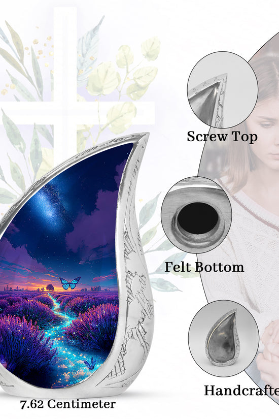 Sapphire Blue Butterfly Cremation Urn angled view of lid and engraved motif - smooth teardrop contour featuring butterfly art - mini keepsake memorial for portion of cremation ashes