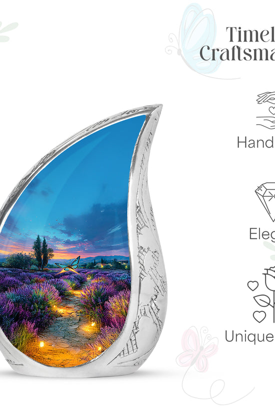 Steel Blue Butterfly Cremation Urn angled view of lid and engraved motif - smooth teardrop contour featuring butterfly art - mini keepsake memorial for portion of cremation ashes