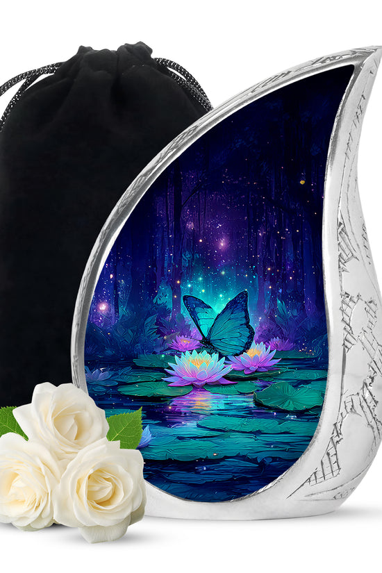 Azure Butterfly Cremation Urn front view showing detailed design - flowing teardrop butterfly silhouette on curved aluminum - full-size 10 inch 200 cubic inch adult cremation urn