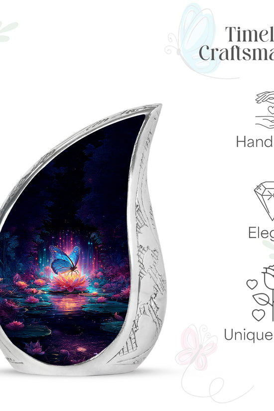 Sapphire Blue Butterfly Cremation Urn angled view of lid and engraved motif - graceful tear-shaped urn with butterfly motif - mini keepsake memorial for portion of cremation ashes