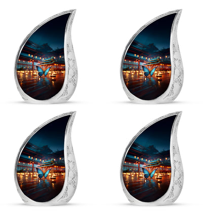 Icy Blue Butterfly Cremation Urn close-up of engraving and surface detail - rounded teardrop butterfly design with delicate detail - 10 inch aluminum urn for cremated remains