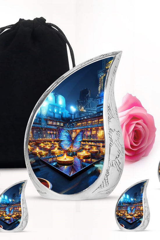 Dove Gray Butterfly Cremation Urn side profile showing urn shape - flowing teardrop butterfly silhouette on curved aluminum - memorial set with one large and four small urns