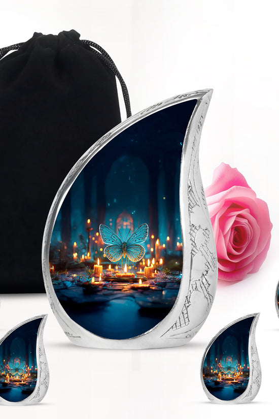 Dusty Blue Butterfly Cremation Urn side profile showing urn shape - rounded teardrop butterfly design with delicate detail - memorial set with one large and four small urns