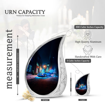 Slate Blue Car Cremation Urn angled view of lid and engraved motif - flowing teardrop car silhouette on curved aluminum - mini keepsake memorial for portion of cremation ashes