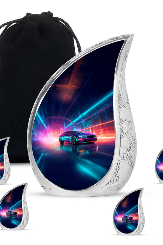 Sky Blue Car Cremation Urn side profile showing urn shape - flowing teardrop car silhouette on curved aluminum - memorial set with one large and four small urns