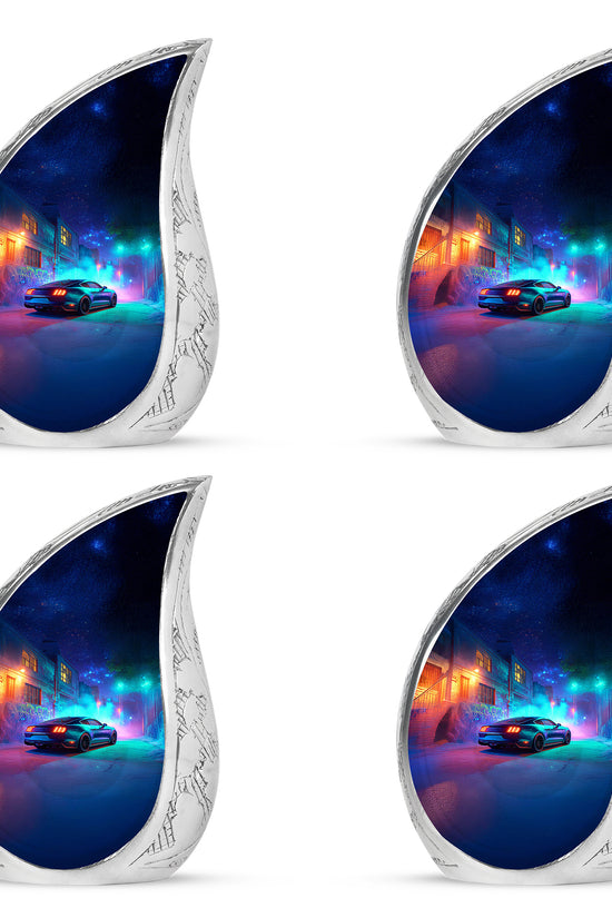 Sapphire Blue Car Cremation Urn close-up of engraving and surface detail - graceful tear-shaped urn with car motif - 10 inch aluminum urn for cremated remains