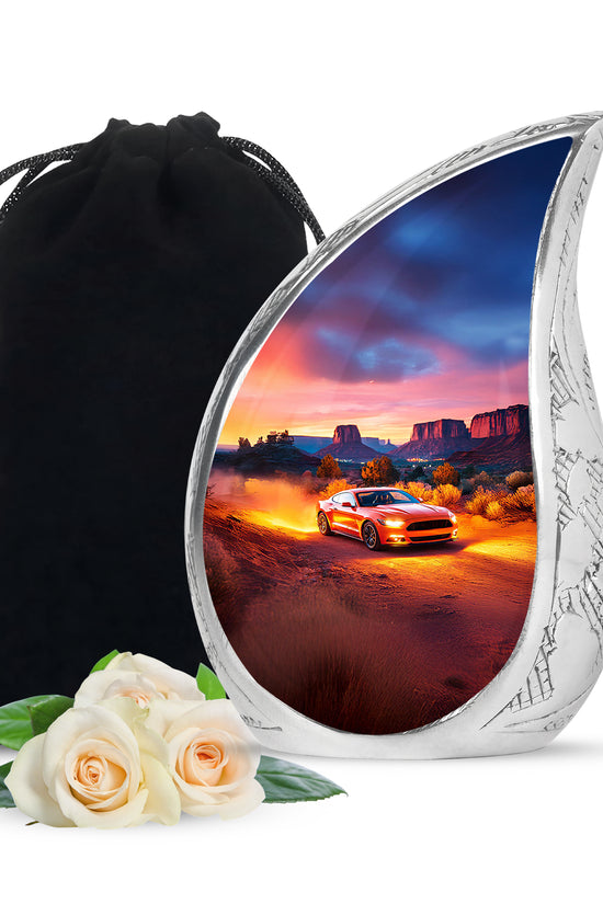 Crimson Red Car Cremation Urn front view showing detailed design - flowing teardrop car silhouette on curved aluminum - full-size 10 inch 200 cubic inch adult cremation urn