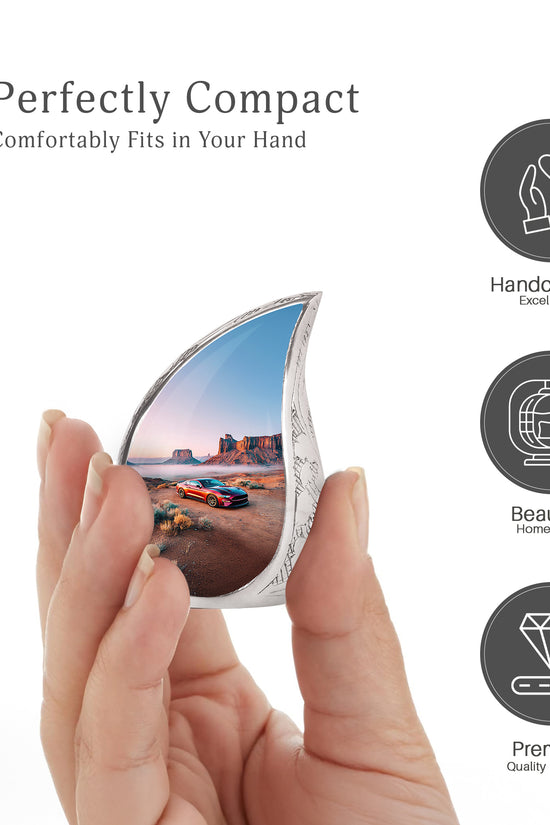 Frosted Silver Car Cremation Urn angled view of lid and engraved motif - smooth teardrop contour featuring car art - mini keepsake memorial for portion of cremation ashes