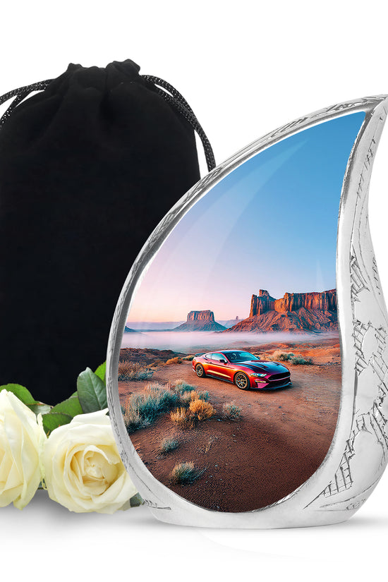 Sterling Silver Car Cremation Urn front view showing detailed design - flowing teardrop car silhouette on curved aluminum - full-size 10 inch 200 cubic inch adult cremation urn