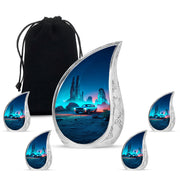 Misty Blue Car Cremation Urn side profile showing urn shape - flowing teardrop car silhouette on curved aluminum - memorial set with one large and four small urns