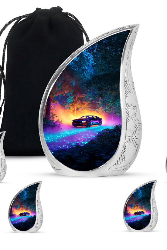 Indigo Car Cremation Urn side profile showing urn shape - flowing teardrop car silhouette on curved aluminum - memorial set with one large and four small urns