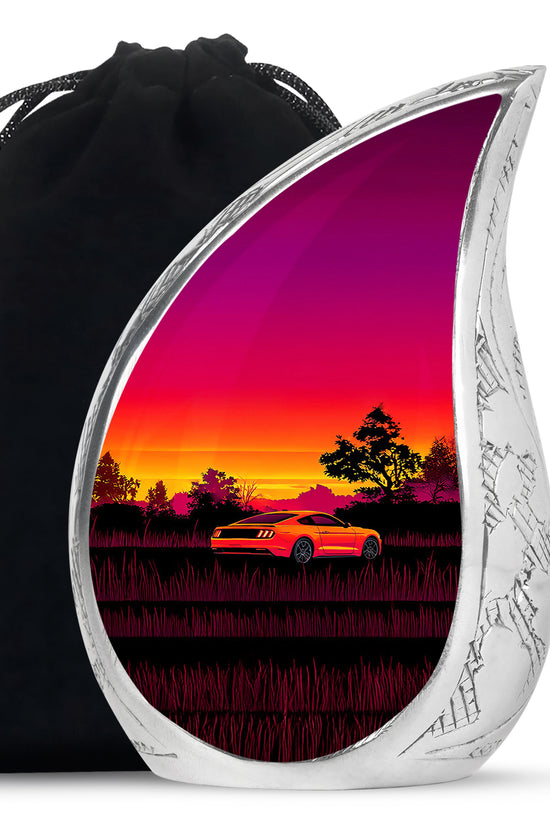 Garnet Red Car Cremation Urn front view showing detailed design - flowing teardrop car silhouette on curved aluminum - full-size 10 inch 200 cubic inch adult cremation urn