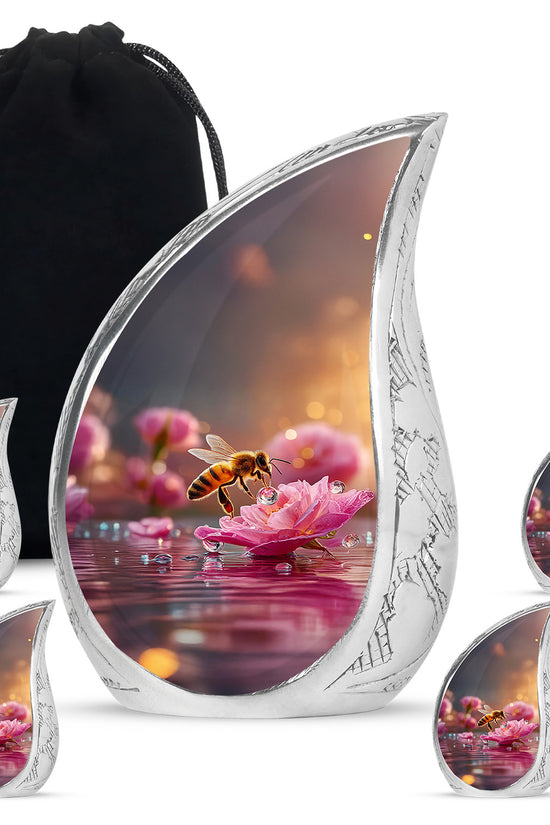 Champagne Gold Bee Cremation Urn side profile showing urn shape - rounded teardrop bee design with delicate detail - memorial set with one large and four small urns