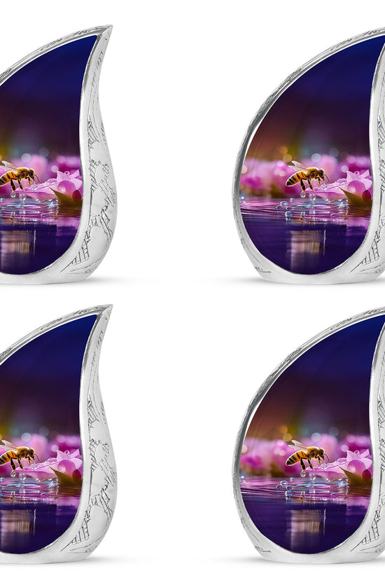 Ruby Red Bee Cremation Urn close-up of engraving and surface detail - smooth teardrop contour featuring bee art - 10 inch aluminum urn for cremated remains