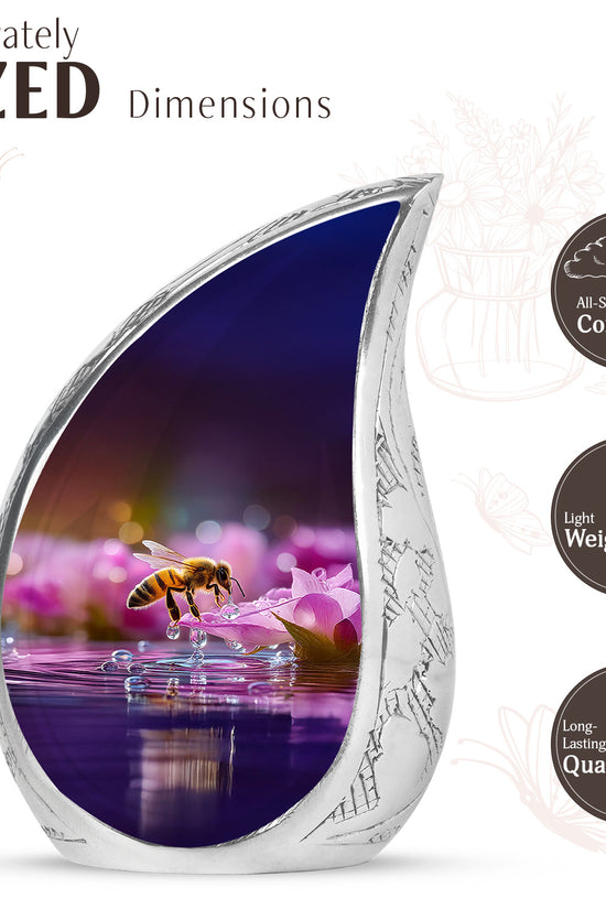 Fiery Red Bee Cremation Urn angled view of lid and engraved motif - graceful tear-shaped urn with bee motif - mini keepsake memorial for portion of cremation ashes