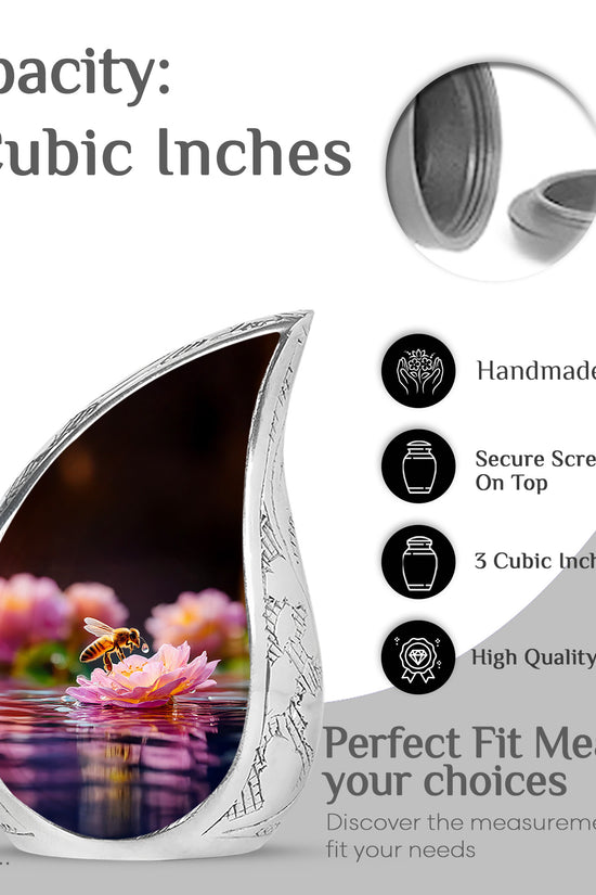 Jet Black Bee Cremation Urn angled view of lid and engraved motif - flowing teardrop bee silhouette on curved aluminum - mini keepsake memorial for portion of cremation ashes