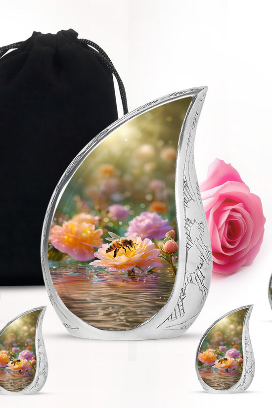 Amber Gold Bee Cremation Urn side profile showing urn shape - flowing teardrop bee silhouette on curved aluminum - memorial set with one large and four small urns