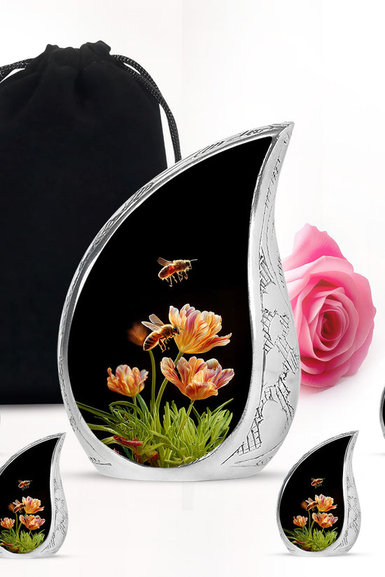 Obsidian Black Bee Cremation Urn side profile showing urn shape - smooth teardrop contour featuring bee art - memorial set with one large and four small urns