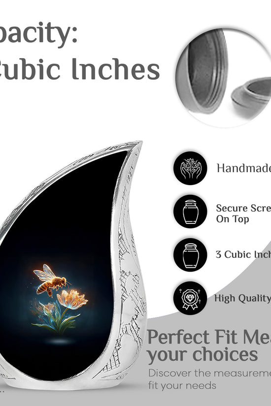 Jet Black Bee Cremation Urn angled view of lid and engraved motif - flowing teardrop bee silhouette on curved aluminum - mini keepsake memorial for portion of cremation ashes