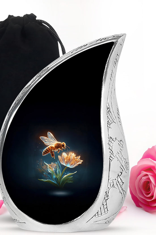 Rich Black Bee Cremation Urn front view showing detailed design - flowing teardrop bee silhouette on curved aluminum - full-size 10 inch 200 cubic inch adult cremation urn
