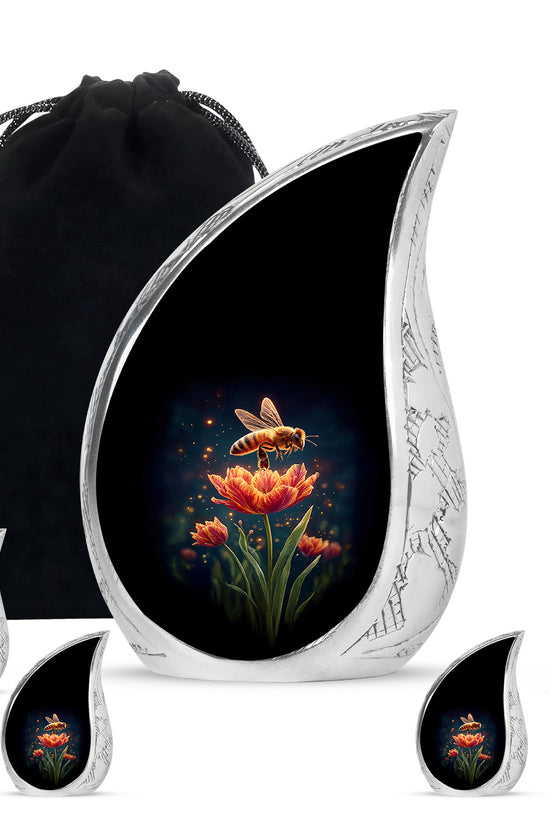Deep Black Bee Cremation Urn side profile showing urn shape - flowing teardrop bee silhouette on curved aluminum - memorial set with one large and four small urns