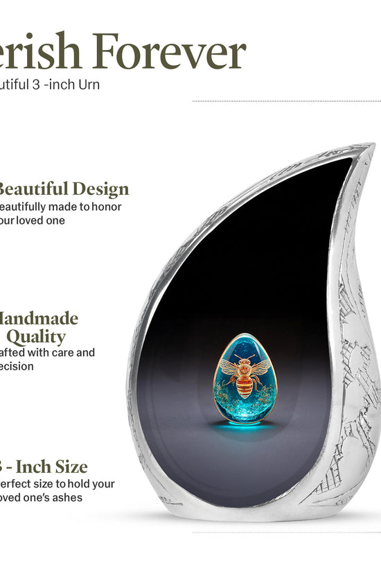 Dark Black Bee Cremation Urn angled view of lid and engraved motif - smooth teardrop contour featuring bee art - mini keepsake memorial for portion of cremation ashes