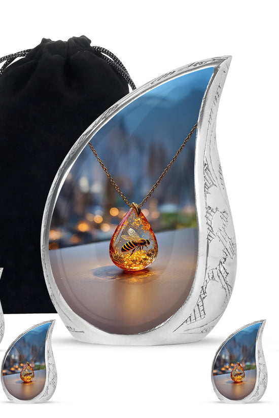Obsidian Black Bee Cremation Urn side profile showing urn shape - graceful tear-shaped urn with bee motif - memorial set with one large and four small urns