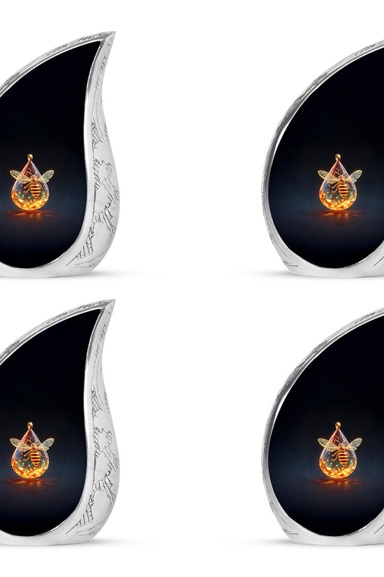 Jet Black Bee Cremation Urn close-up of engraving and surface detail - flowing teardrop bee silhouette on curved aluminum - 10 inch aluminum urn for cremated remains