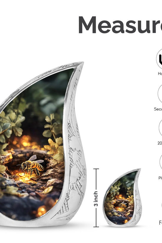 Harvest Gold Bee Cremation Urn angled view of lid and engraved motif - smooth teardrop contour featuring bee art - mini keepsake memorial for portion of cremation ashes
