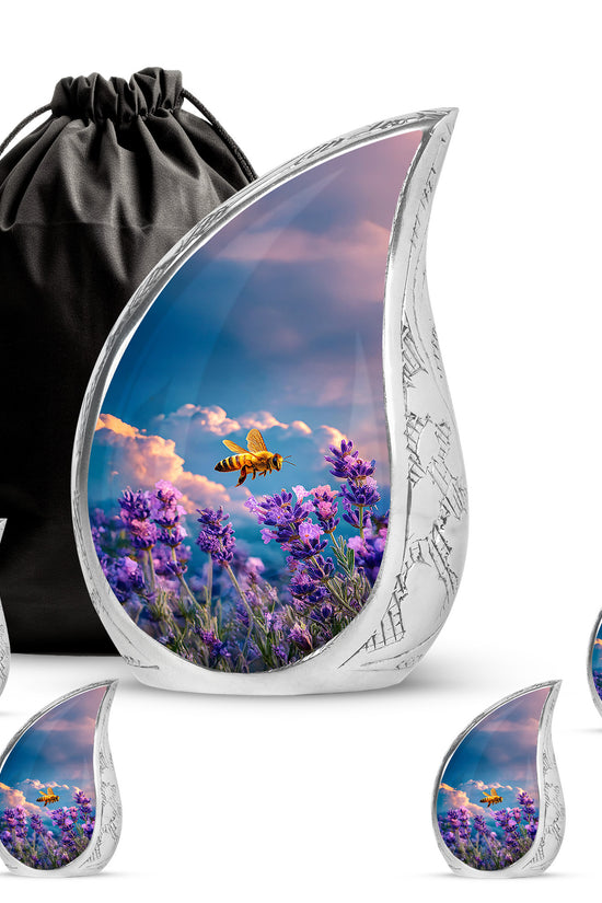 Celestial Blue Bee Cremation Urn side profile showing urn shape - flowing teardrop bee silhouette on curved aluminum - memorial set with one large and four small urns